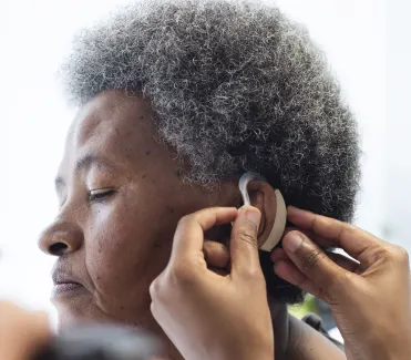 A old woman testing Ear Machine